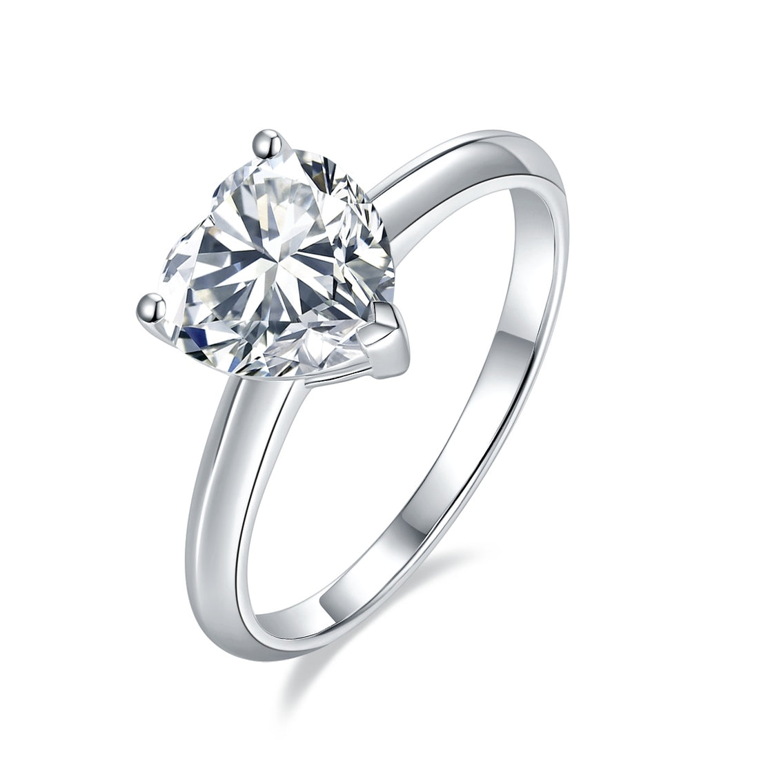 Silver ring with a heart-shaped diamond on a white background