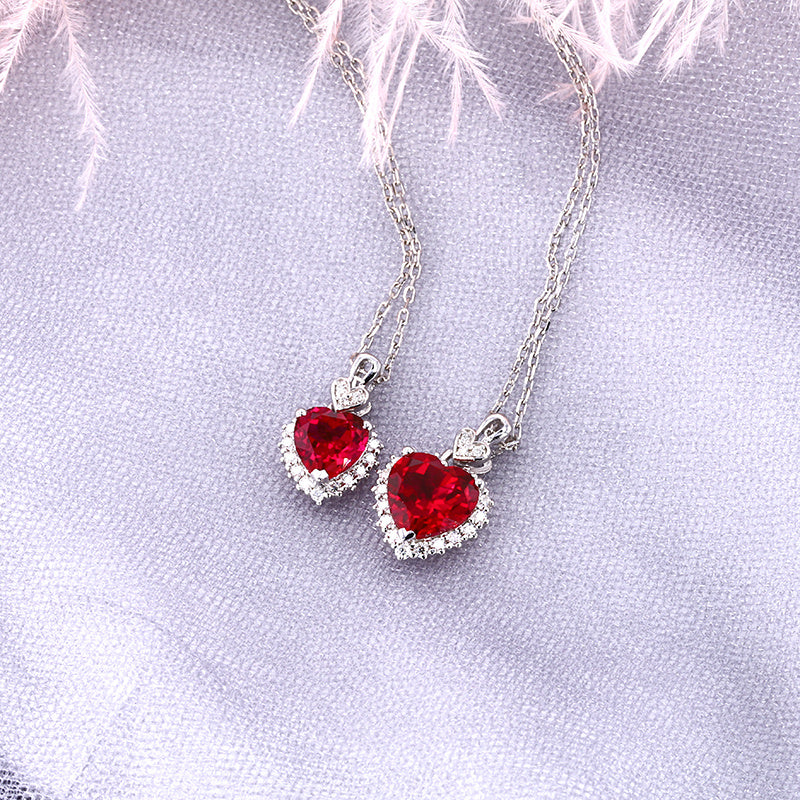 pigeon blood lab ruby heart necklaces 1ct and 2ct moissanite halo sterling silver – side by side UK
