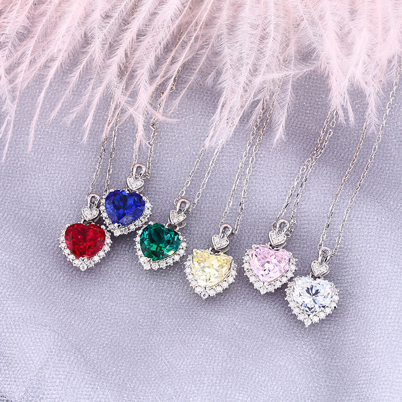 heart necklace collection ruby sapphire emerald yellow pink clear CZ moissanite halo sterling silver – group shot UK