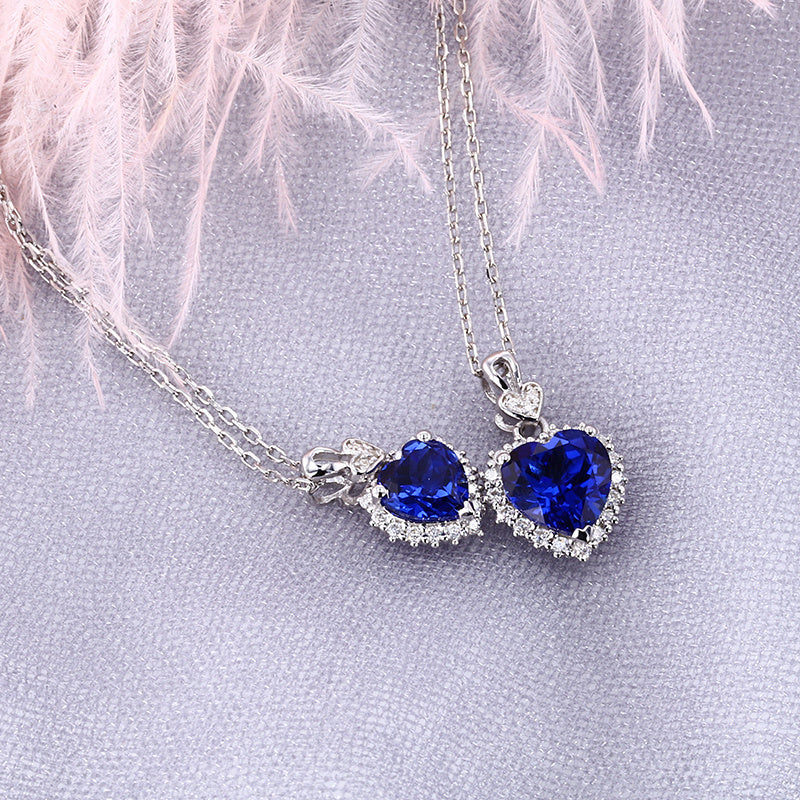 royal blue lab sapphire heart necklaces 1ct and 2ct moissanite halo sterling silver – side by side UK
