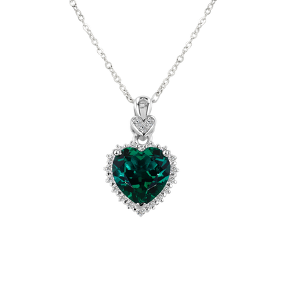 Heart-shaped emerald pendant on a white background