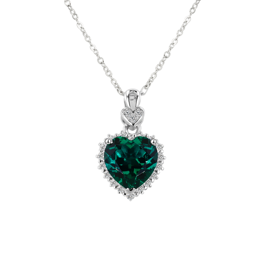 Heart-shaped emerald pendant on a white background