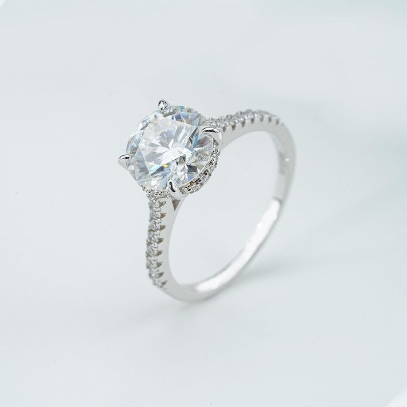 Silver ring with a large diamond on a light gray background