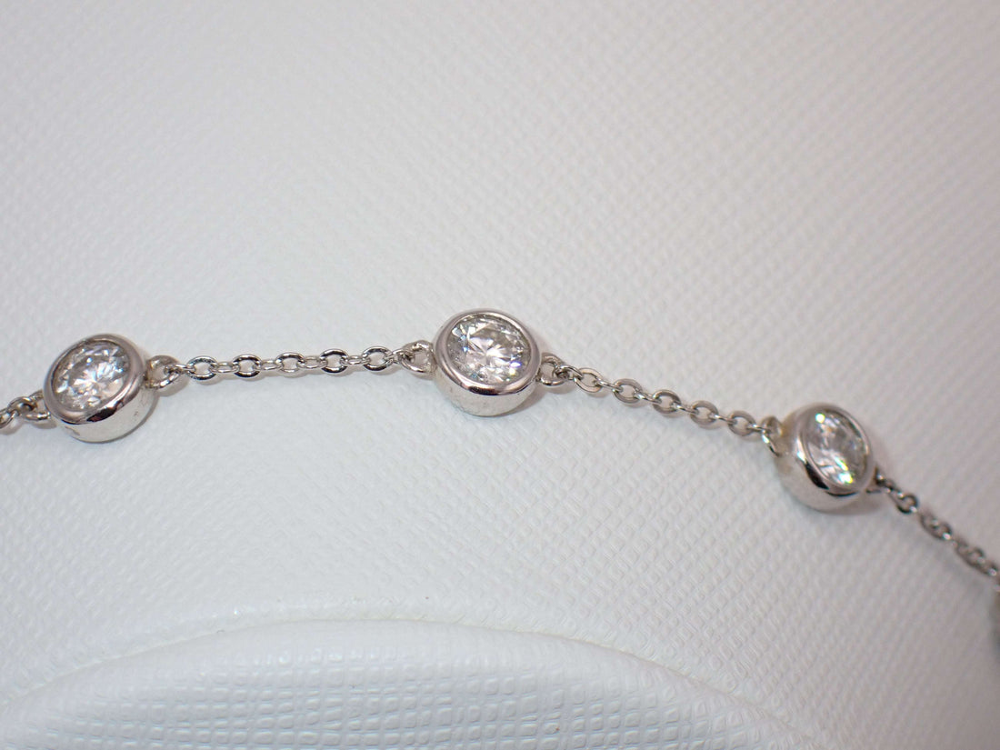 Six stone moissanite bracelet – bezel set sterling silver jewellery UK – Mara & Co UK