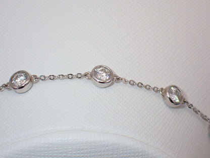 Six stone moissanite bracelet – bezel set sterling silver jewellery UK – Mara & Co UK