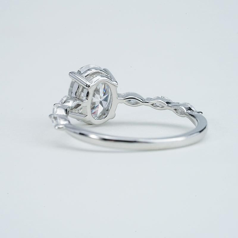 Silver ring with a diamond on a light gray background