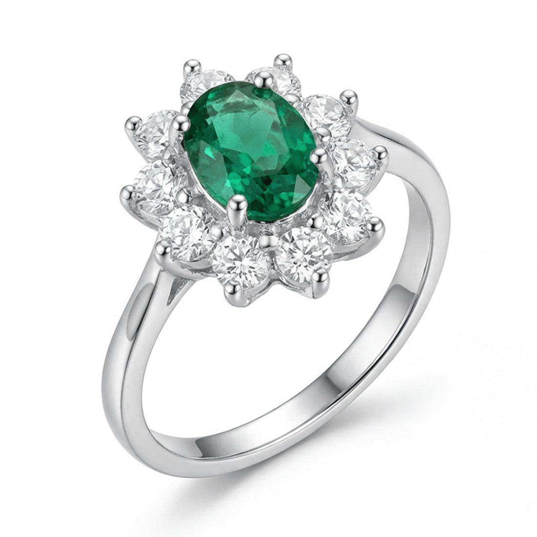 Silver ring with a green gemstone and diamond-like stones on a white background